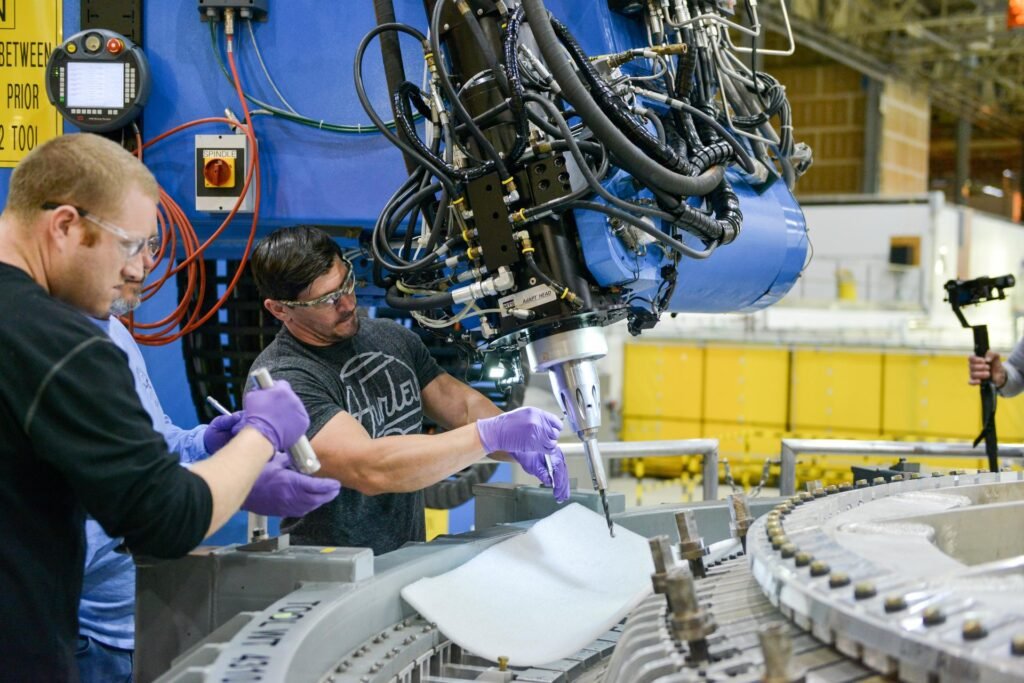 Technicians working together on Orion spacecraft hardware at NASA’s Michoud Assembly Facility.